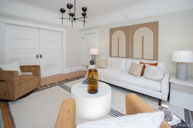 living room featuring a chandelier and wood finished floors