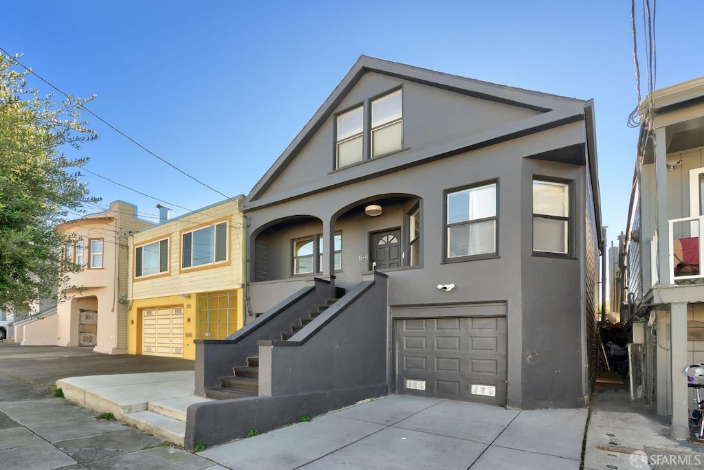 289 Sadowa St, San Francisco, CA 94112 - view of front of home featuring stucco siding, an attached garage, and concrete driveway