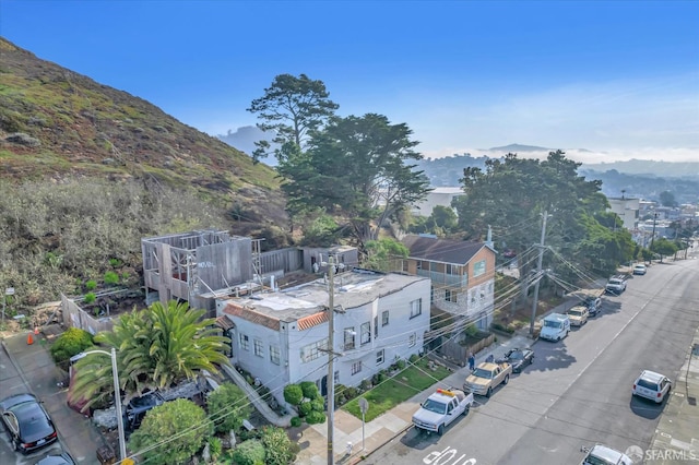 birds eye view of property with a mountain view