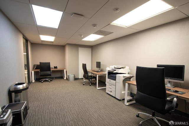 carpeted office featuring a paneled ceiling