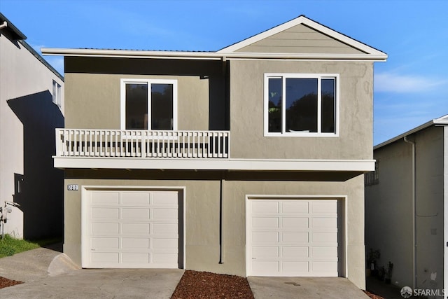 view of front facade featuring a garage and a balcony