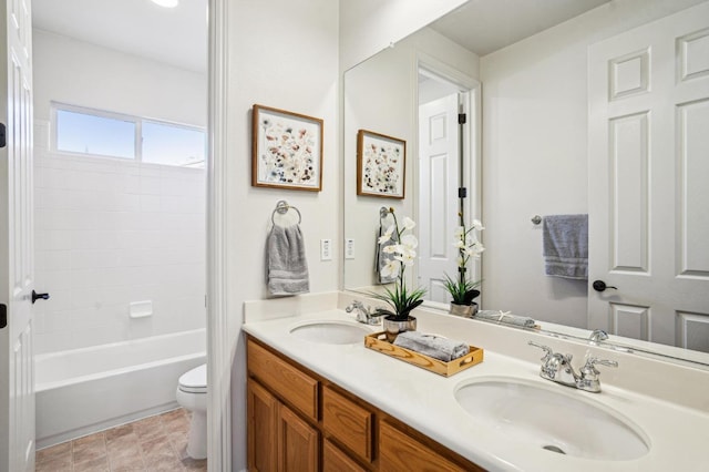 full bathroom featuring vanity, toilet, and shower / washtub combination