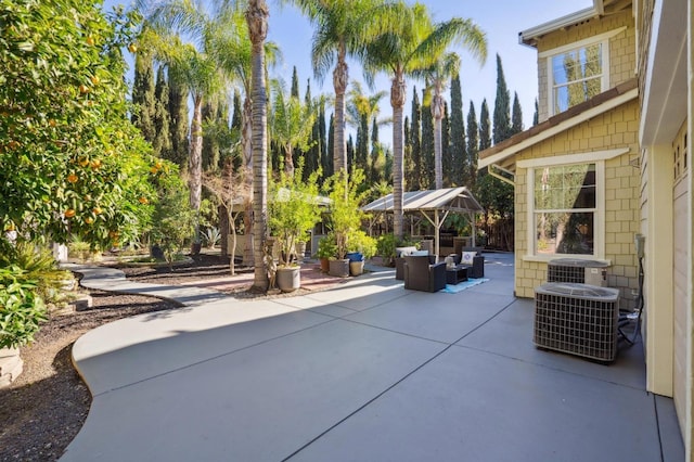 view of patio featuring an outdoor living space and central AC