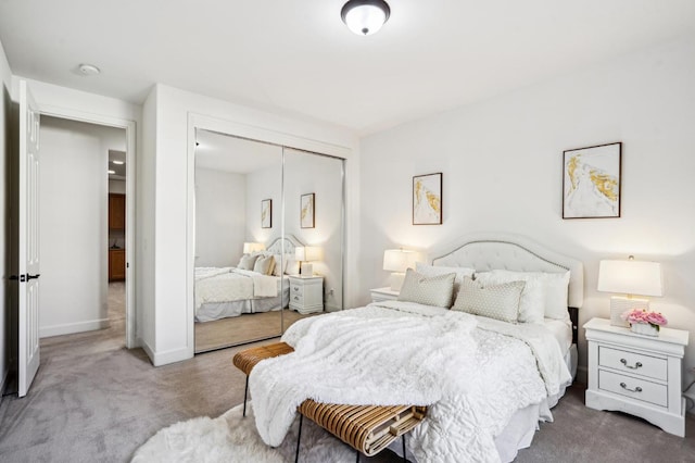 bedroom featuring a closet and carpet flooring