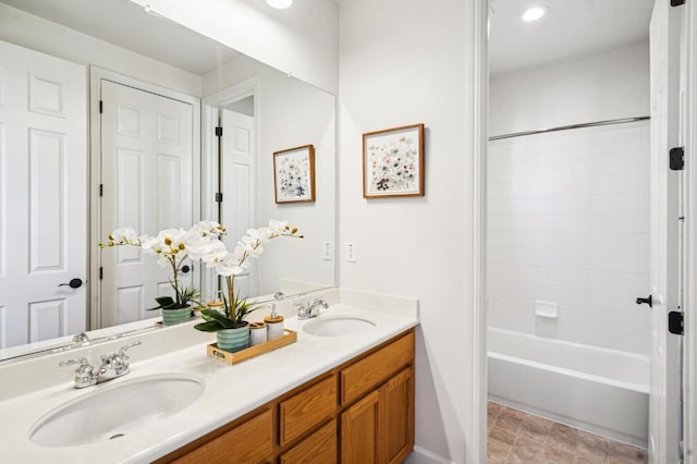 bathroom featuring vanity and shower / washtub combination