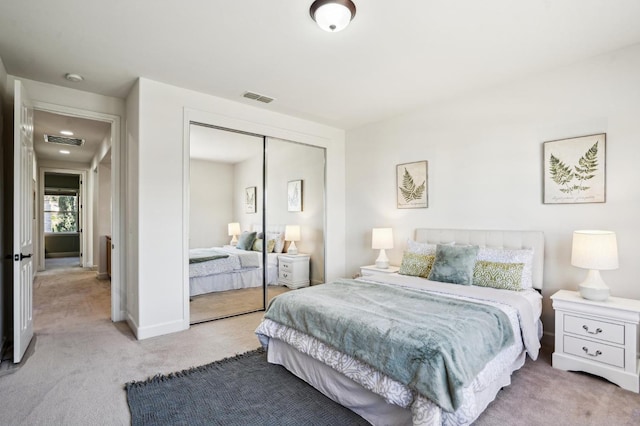 carpeted bedroom featuring a closet