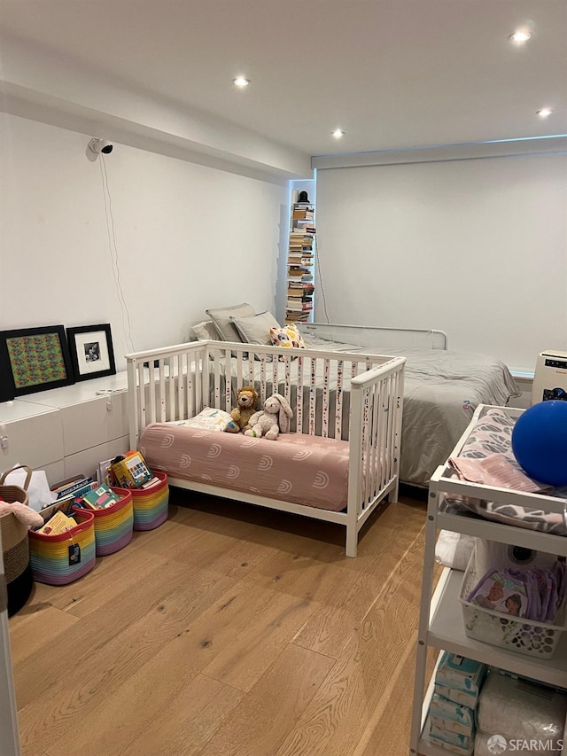 bedroom featuring wood-type flooring