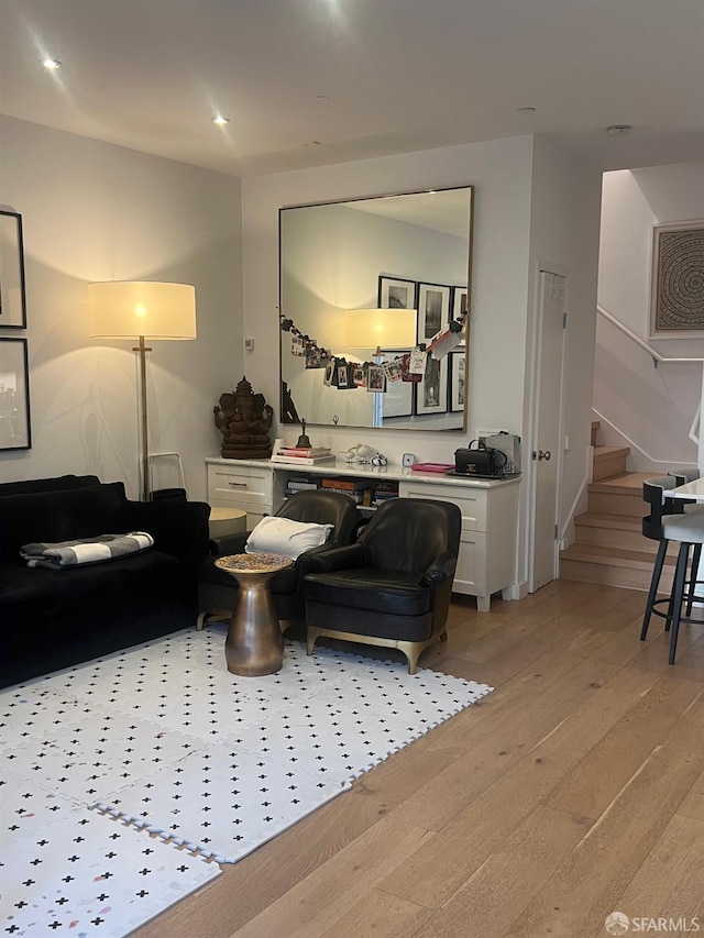 living room with light hardwood / wood-style flooring