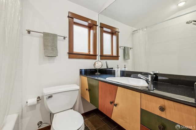 full bathroom featuring vanity, shower / tub combo, tile patterned flooring, and toilet