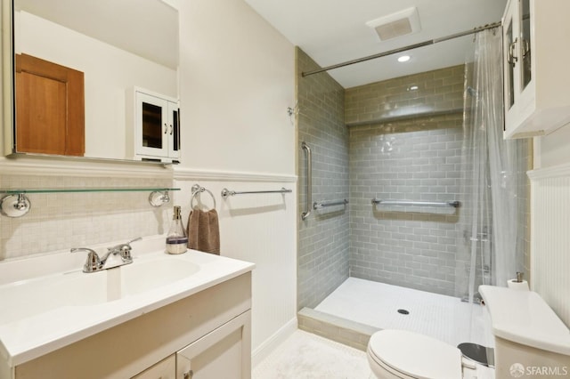 bathroom featuring vanity, toilet, and a shower with curtain