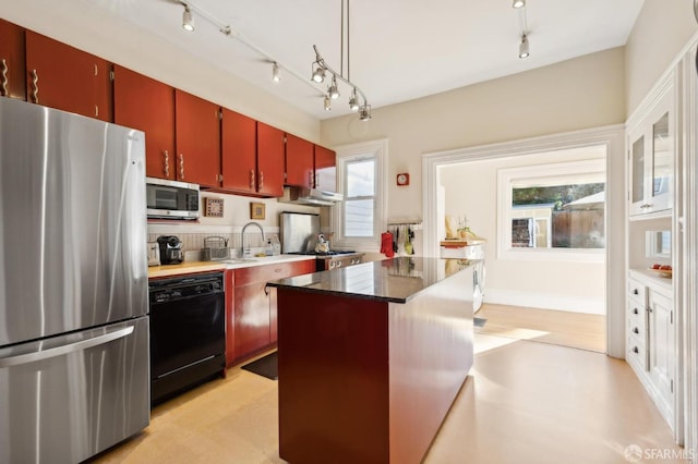 kitchen featuring stainless steel appliances and a center island