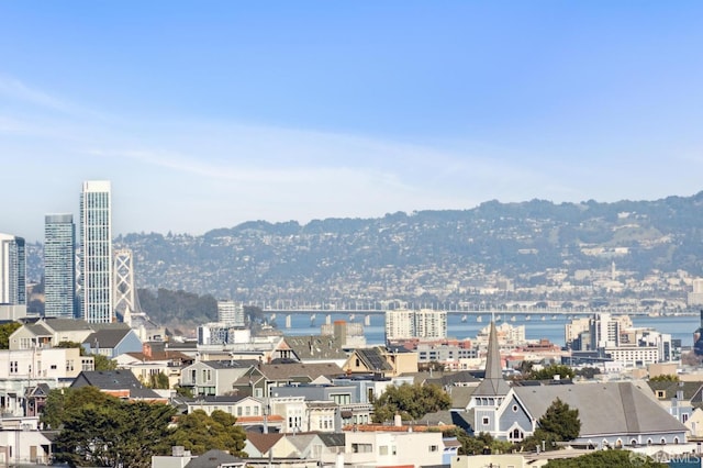 property's view of city featuring a water view