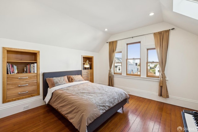 bedroom featuring lofted ceiling and dark wood-type flooring