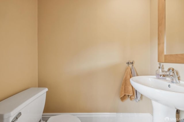 bathroom with sink and toilet