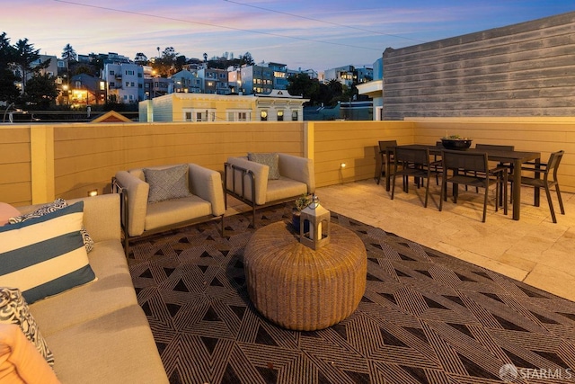 view of patio terrace at dusk