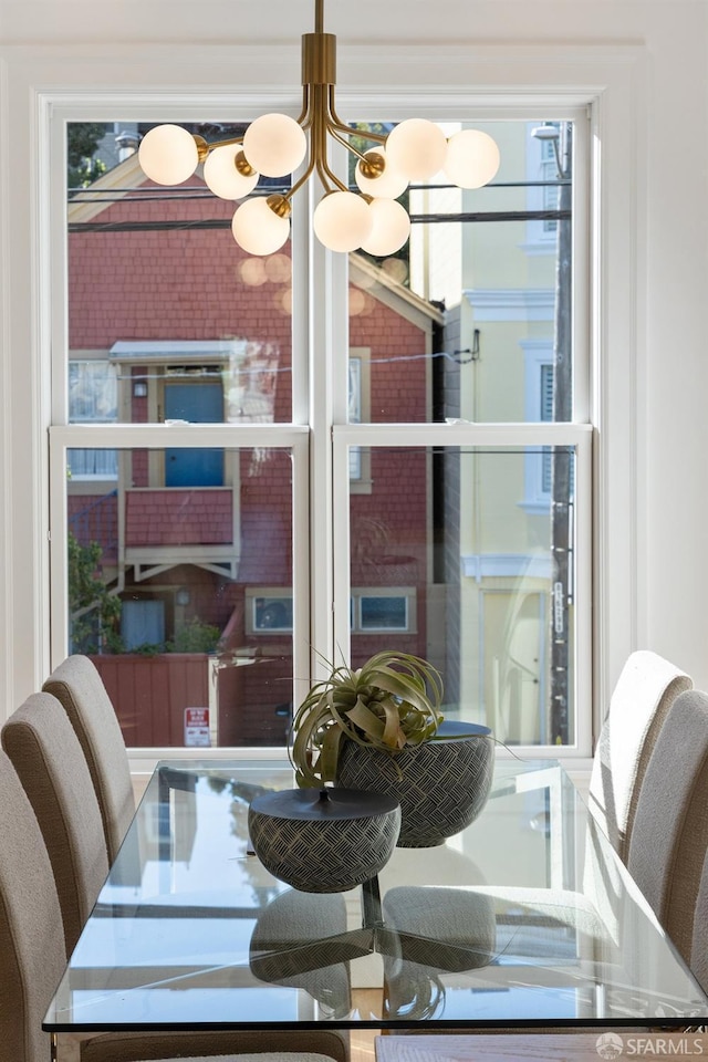 dining room with plenty of natural light and a chandelier