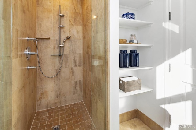 bathroom with an enclosed shower and ornamental molding