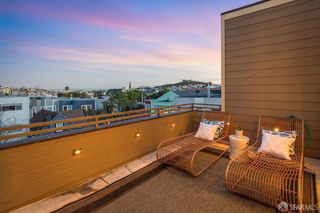 view of balcony at dusk