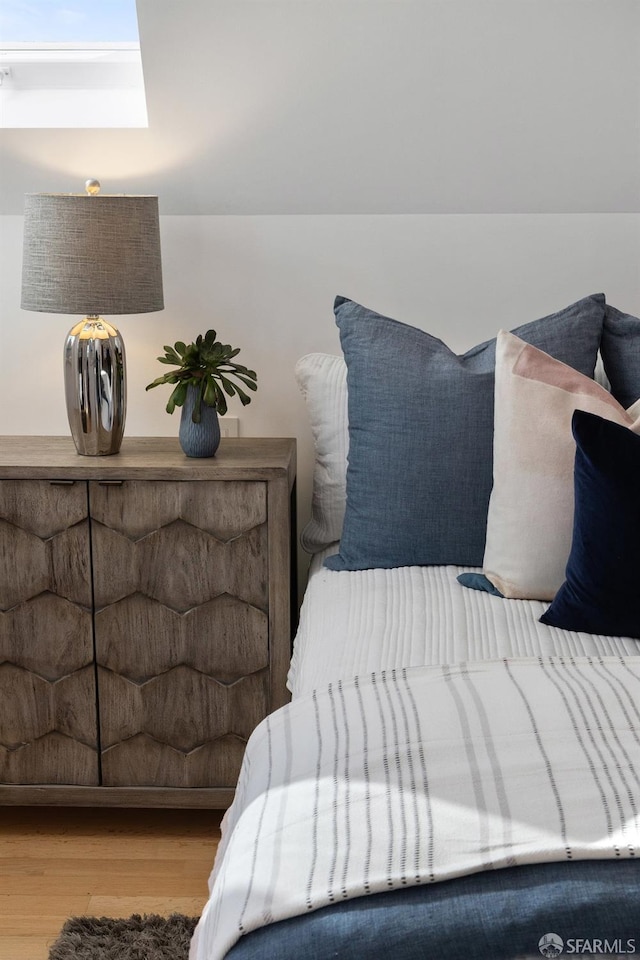 bedroom with hardwood / wood-style floors