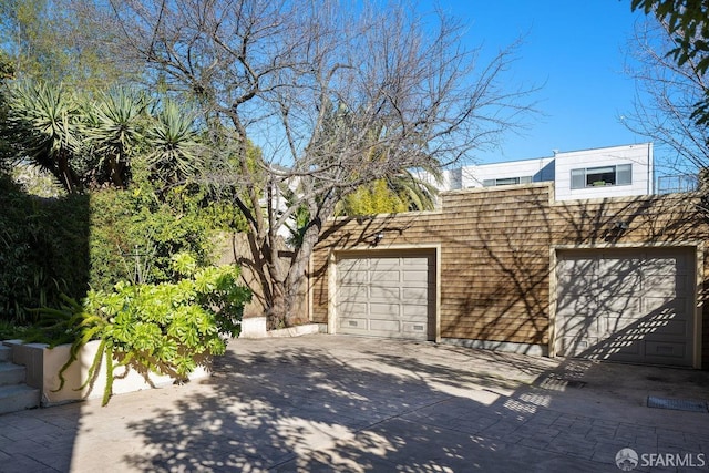 view of side of property featuring a garage