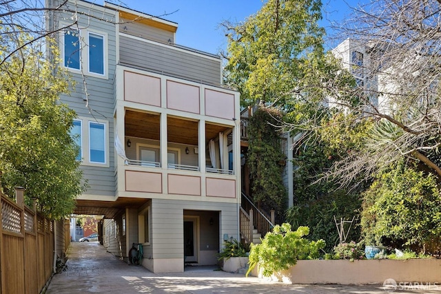 rear view of house featuring a balcony