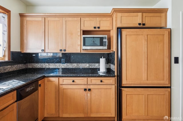 kitchen featuring built in appliances, dark stone countertops, and decorative backsplash