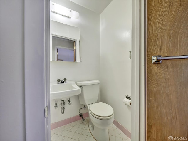 bathroom featuring tile patterned flooring and toilet