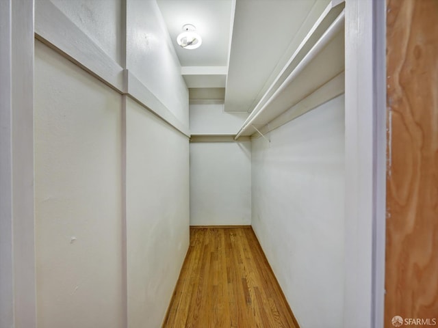 walk in closet featuring light wood-type flooring