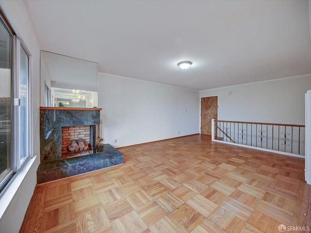 unfurnished living room with a healthy amount of sunlight, light parquet flooring, and an inviting chandelier