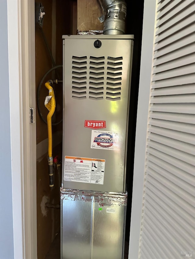 utility room with heating unit