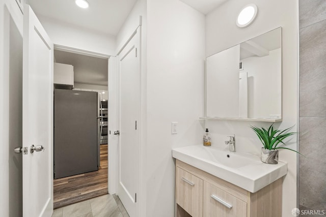 bathroom with vanity and recessed lighting