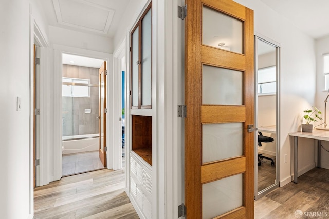 hallway featuring light wood-type flooring