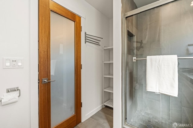 full bathroom featuring a shower stall