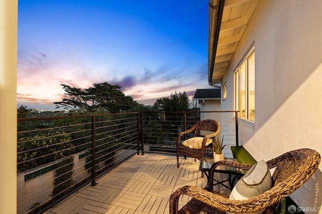 view of balcony at dusk