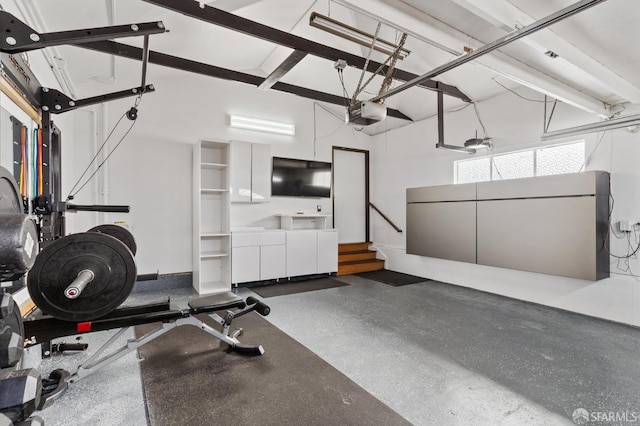 exercise room with a garage