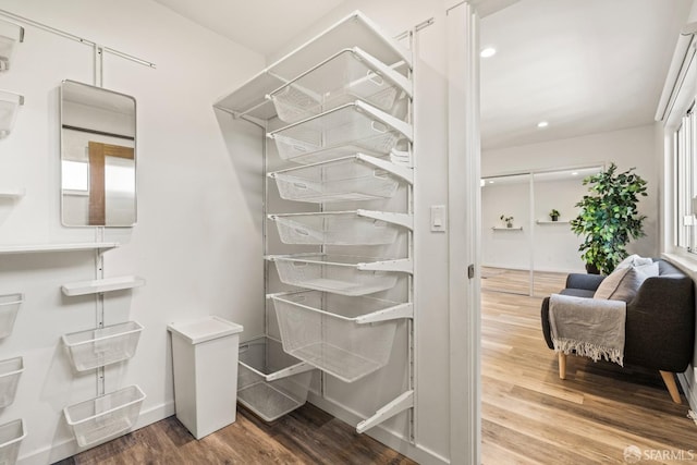 spacious closet with wood finished floors