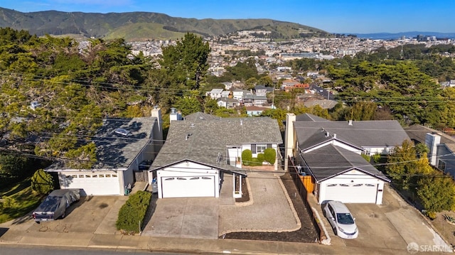 birds eye view of property with a mountain view