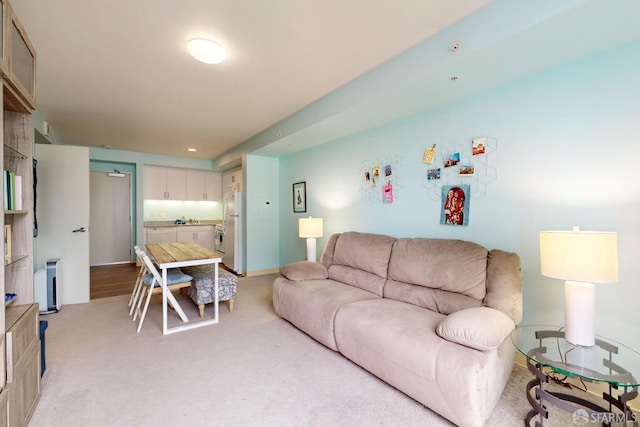 living room featuring light carpet