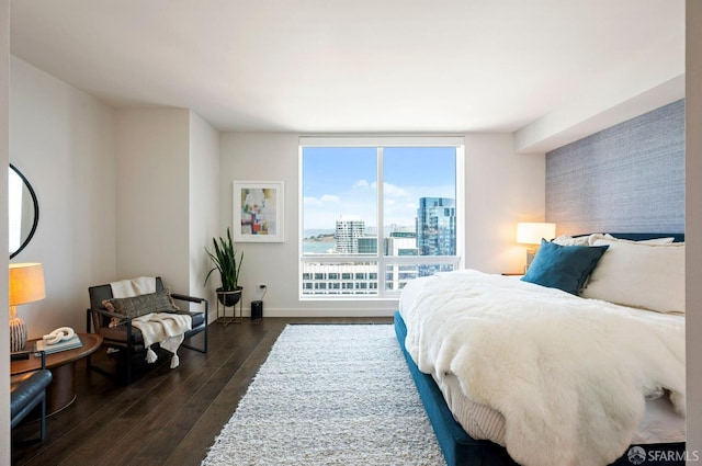 bedroom featuring dark wood-type flooring