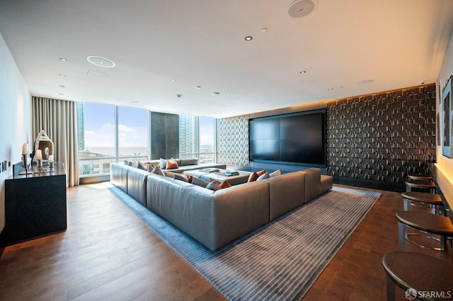 living room with wood-type flooring and floor to ceiling windows