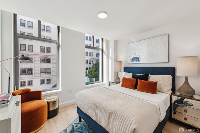 bedroom with light hardwood / wood-style flooring