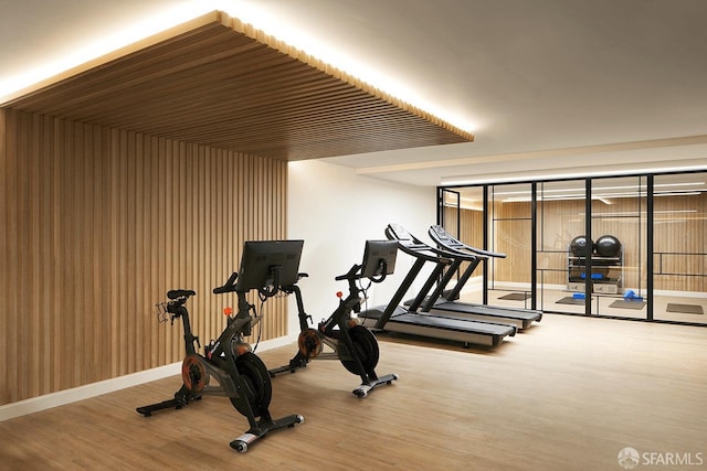 gym featuring wood-type flooring and wood ceiling