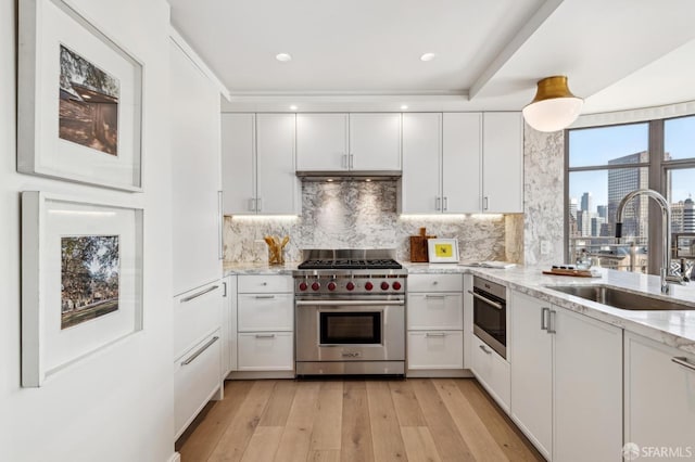 kitchen featuring white cabinetry, sink, and stainless steel appliances