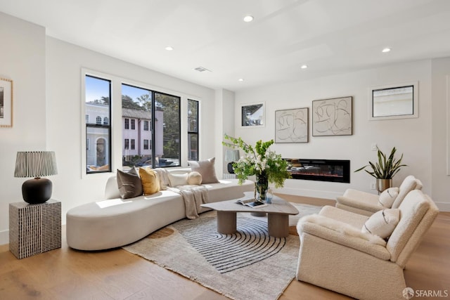867 33rd Ave, San Francisco, CA 94121 - living room with wood finished floors, recessed lighting, a glass covered fireplace, and baseboards