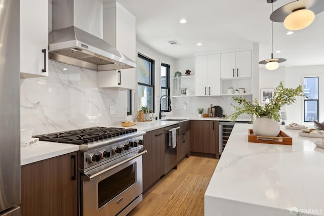 867 33rd Ave, San Francisco, CA 94121 - kitchen with stainless steel appliances, wall chimney exhaust hood, open shelves, wine cooler, and white cabinetry