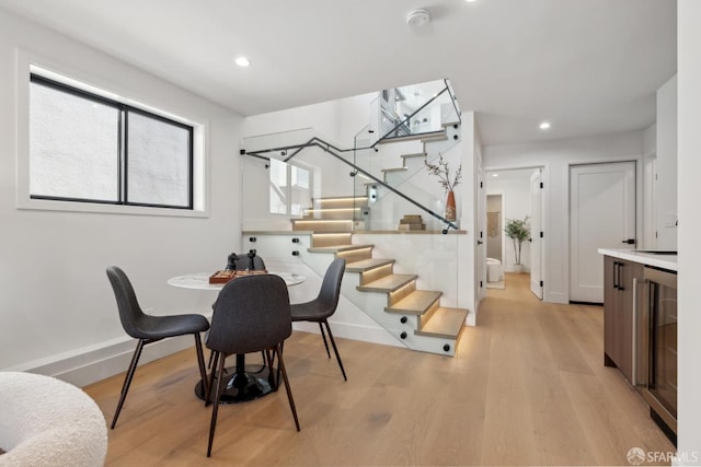867 33rd Ave, San Francisco, CA 94121 - dining room featuring wine cooler, baseboards, light wood-type flooring, stairway, and recessed lighting