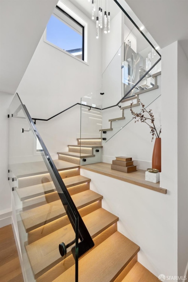 867 33rd Ave, San Francisco, CA 94121 - staircase featuring wood finished floors