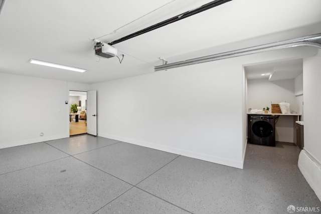 867 33rd Ave, San Francisco, CA 94121 - garage with washer / clothes dryer, a garage door opener, and baseboards