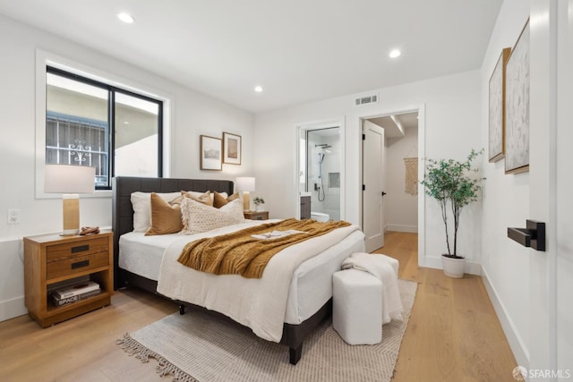 867 33rd Ave, San Francisco, CA 94121 - bedroom with light wood finished floors, recessed lighting, baseboards, a spacious closet, and ensuite bath