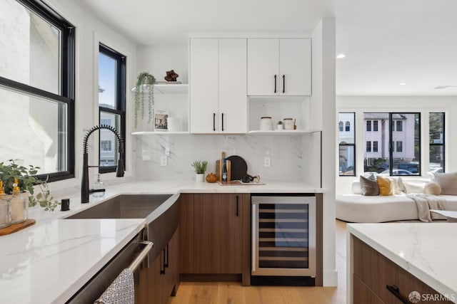 867 33rd Ave, San Francisco, CA 94121 - indoor bar with wine cooler, decorative backsplash, light wood-style floors, and recessed lighting